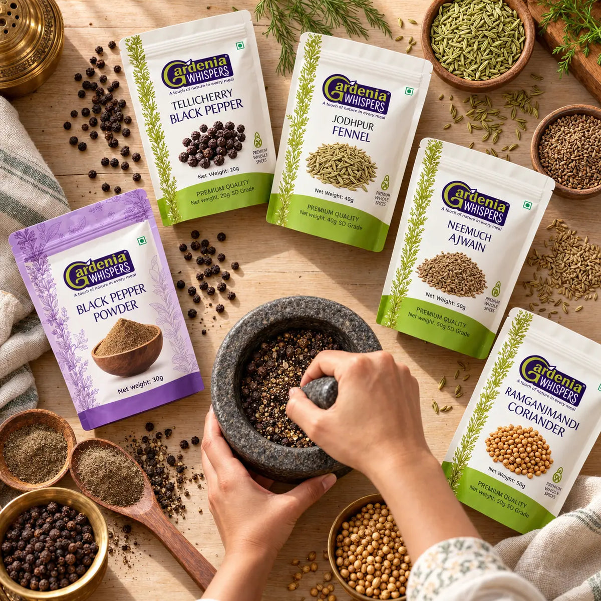 Gardenia Whispers whole spice collection with Tellicherry Black Pepper Jodhpur Fennel Neemuch Ajwain Ramganjmandi Coriander and Black Pepper Powder packs with stone mortar pestle